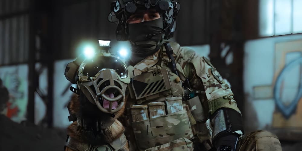 Soldier in tactical gear holding a K9 helmet designed for specialized working dogs in challenging environments.