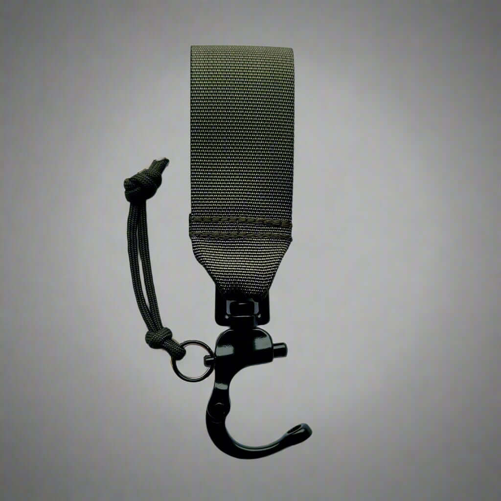 Taktiskt snabblås för hundkoppel, vilket möjliggör snabb frikoppling med en hand, designat för hundförare.