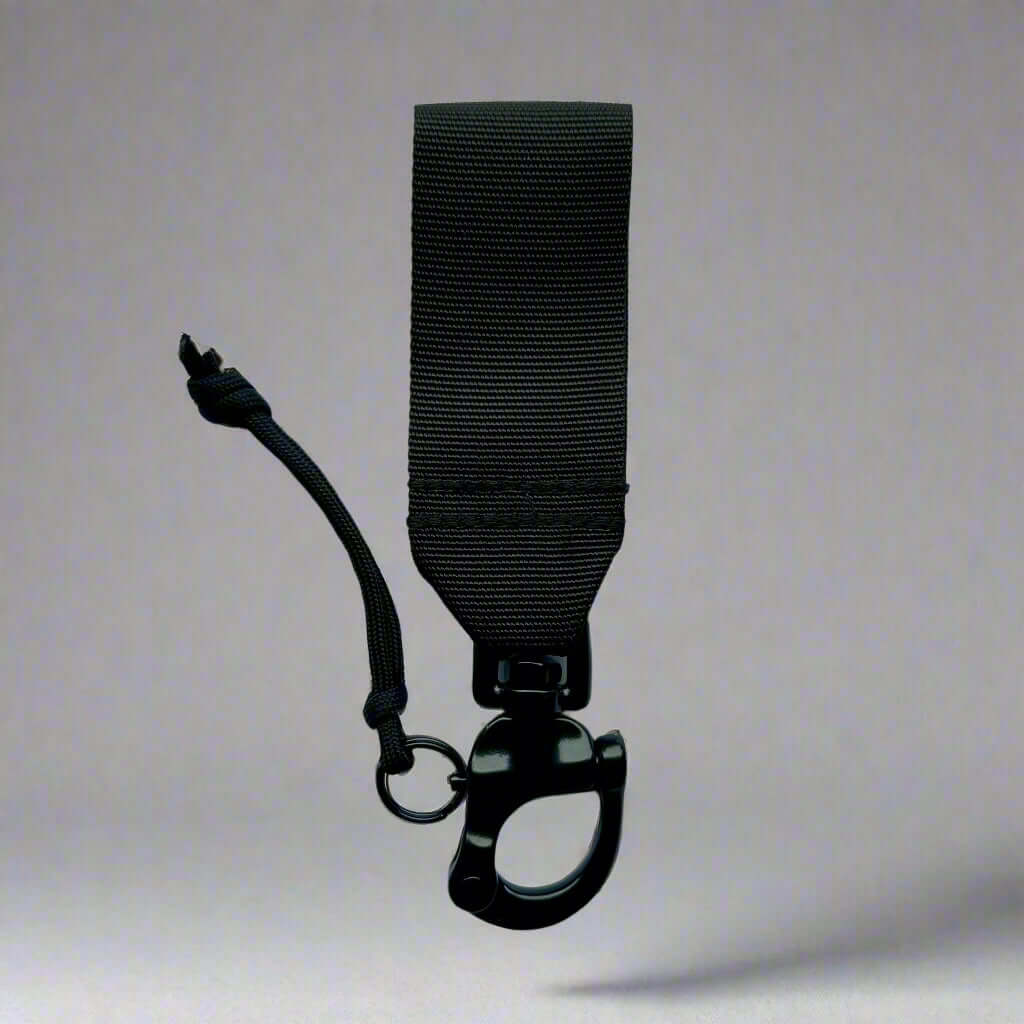 Compact tactical quick release clip for dog leash, designed for swift one-handed operation in critical situations.